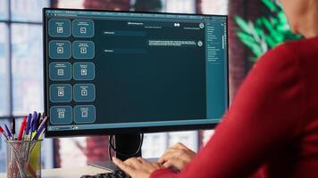 Professional person engaging with an AI chatbot on a computer screen, exploring power of digital assistance through artificial intelligence. Solutions for assistance at desktop. Camera A. photo