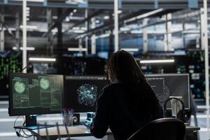 Data center IT expert looking at network traffic patterns, detecting security threats. Engineer doing AI visualization threat mapping, developing automated firewalls and intrusion detection solutions photo