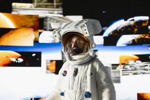 Male astronaut in a space suit floats in orbit above Earth, symbolizing the journey of humanity into cosmos. Endless pursuit of discovery, technology and exploring the unknown universe. photo