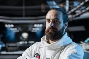 Portrait of astronaut researcher exploring deep space, collecting research data during flight. Scientist wearing cosmonaut gear in spaceship observing scientific reactions in orbit photo