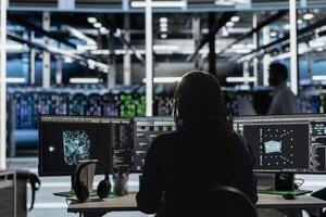 Data center software developer using artificial intelligence visualization tools on device to identify errors. Server hub staff member looking at insights to detect hardware failures photo