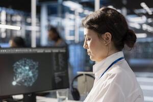 Data center computer scientist analyzing software logs metrics on PC monitor, optimizing systems. Close up of woman in server farm inspecting resource utilization, managing application efficiency photo