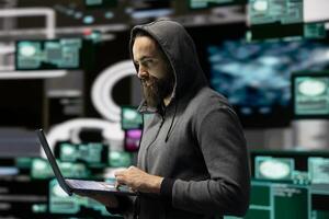 Skilled IT expert compromising cyber security through malware and viruses, digital threat of hacking with unauthorized intrusion into secure networks. Leading to quantum threat and risk. photo
