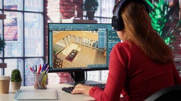Designer interacts with digital technology to produce a virtual home set. Architectural software enables 3D modeling and rendering, placement of furniture and layout adjustments. Camera A. photo