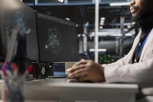 Close up of programmer in data center using AI powered tech to run simulations. IT expert coding cognitive computing algorithms to extract insights from data and automate rigs photo