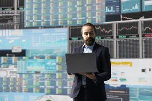 Young startup entrepreneur uses digital materials and analytics to improve development models for fruitful management decisions. Optimizing performance metrics with complexity. photo