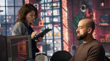 Game developer creates Mars based virtual station using AI tools. Futuristic program processes data with deep learning and automation to optimize game design and development. Camera B. photo