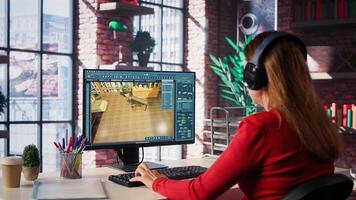 Woman at home creating 3D render of apartment interior layout, utilizing architectural software. Developer uses digital tools to decorate detailed home design, placing assets. Camera B. photo
