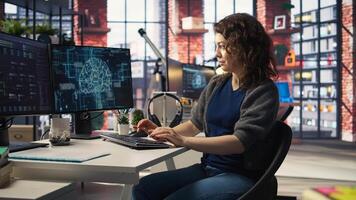 Teleworking developer using computer for artificial intelligence computing through self learning algorithms. Agency IT engineer works with AI deep neural networks on desktop PC. Camera A. photo