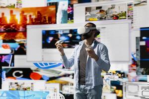 Modern cool man uses virtual reality glasses for a 3d web connection, vr simulation showcasing innovation for social media engagement. Influencer working on visual storytelling and global reach. photo