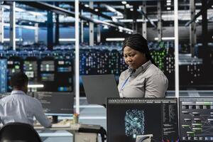 Data center engineer leverages artificial intelligence visualization tools to identify real time performance anomalies within server clusters and network segments, configuring hardware photo