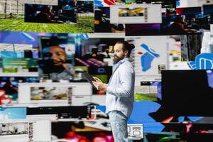 Content creator connecting with a global social media audience through mobile technology, using digital tools for storytelling and branding to build influence, engagement and online presence. photo
