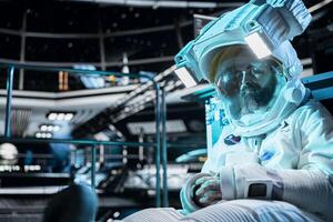 Exhausted cosmonaut sleeping inside spacecraft during extended planetary mission. Tired starship crew member resting on floor while orbital station travels across deep space photo