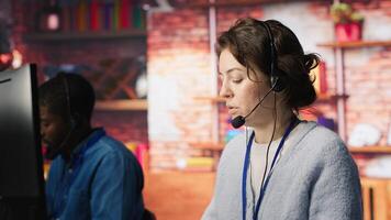 Call center agent helping customers regain access to accounts, resetting passwords. Employee assisting clients needing help by providing helpful solutions, camera A photo