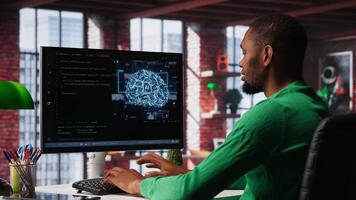 System administrator programming AI brain computerized model of neural network for machine learning. Debugging software algorithm and checking for errors. Camera A. photo