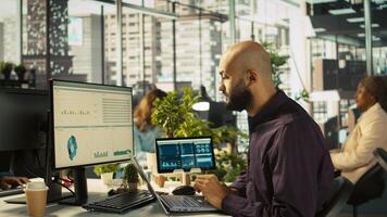 Bookkeeper at work happy after completing to read and verify business documents. Cheerful employee pleased with finishing to analyze company information records, camera B photo