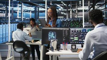 Engineering team using AI algorithms and node tree systems to categorize unstructured data. Data center IT experts use visual programming and natural language processing software, camera A photo