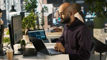 Jolly bookkeeper finally finishes reading and verifying business documents. Cheerful employee completes analyzing company information records, camera A photo