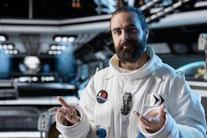 Portrait of cosmonaut exploring deep space, preparing for planetary mission outside. Man in orbital station ensuring operational readiness before beginning landing procedures on solar system planet photo