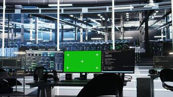Mockup PCs in data center control using node tree tech interfaces. Isolated screen workstations automate and supervise operations in server farm using visual programming photo