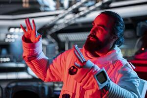 Astronaut raises hand defensively after triggering red light motion alert near restricted zone. Crew member reacts as unknown intruder breaches proximity sensors aboard space station photo
