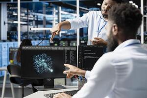Server hub manager supervising engineer using AI algorithms categorizing and clustering unstructured data. Data center supervisor overseeing worker using Natural Language Processing tech photo