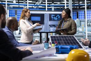 Engineers and scientists collaborate on solar panel research and development, analyzing data and experimenting with advanced materials to develop innovative renewable energy solutions photo