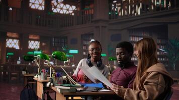 University students learning accounting principles and financial analysis for business administration courses, leveraging textbooks and materials in library. Entrepreneurship. Camera B. photo