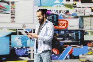 Modern online lifestyle of an influencer checking real time notifications, enjoying interaction with followers and posting creative content in a modern social network environment. photo