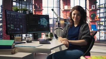 Admin writing code and doing maintenance on artificial intelligence neural networks computerized model. Woman tech support expert doing checkup on AI systems, data science. Camera A. photo