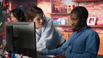 Call center manager teaching intern how to track shipment parcels. Customer center team leader doing induction to trainee, locating clients packages and providing status updates, camera A photo