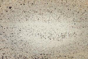 Textured background featuring a unique blend of colors and patterns on a concrete surface. photo