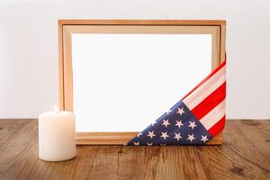 . Blank white photo frame for mockup design on American national flag wooden background