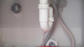 Broken Sink with Leaking Siphon in Kitchen Close-Up of Plumbing Problem and Water Damage video