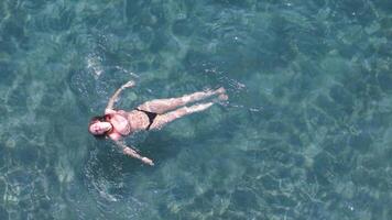 Girl Swimming in Shallow Clear Waters of Neos Marmaras Greece Relaxed Travel Moment from the Sky video