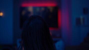 Solitude and Comfort at Night. Woman Watching a Movie Alone on Her Sofa with Popcorn and Blanket video