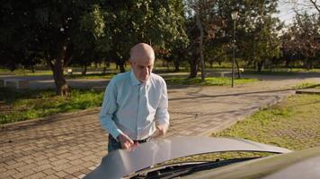 Old Man Checks the Engine Condition of His Car video