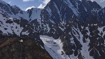 Rugged mountain terrain with snow-covered cliffs in the Caucasus video