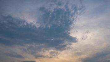 A sunset with clouds and a plane flying in the sky video