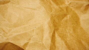 Vintage sepia toned crumpled paper texture background. Stop motion animation of old paper with creases and damage. Abstract grunge paper texture. Full HD and looping animation.. video