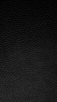 Black leather texture stop motion background. Full HD vertical loop. video