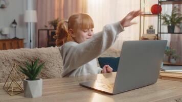 Young girl frustrated after losing game on laptop, expressing disappointment with upset reaction video