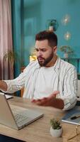 Displeased sad businessman using laptop loss game fail computer virus error bad news at home office video