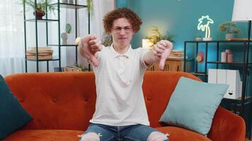 Upset unhappy man showing thumbs down dislike gesture expressing discontent disapproval dissatisfied video