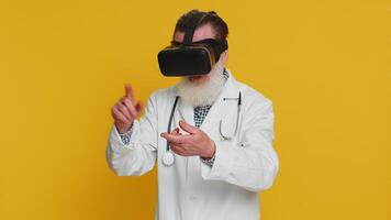 Excited doctor in VR goggles man using headset helmet app, watching virtual reality 3D 360 video