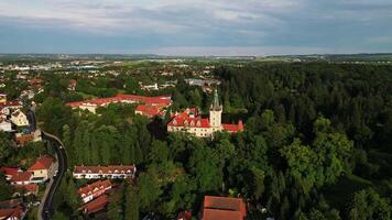 Aerial far orbiting view of Pruhonice chateau and park in May 2025 in Czechia video