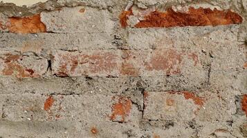 Broked wall with lining from bits of broken brick. Used as a background. photo