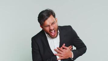 Stressed sick business man suffers from tension holding chest with heart pain attack risk of stroke video