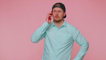 Man talking on phone, pleasant mobile conversation using smartphone with friends, telling good news video
