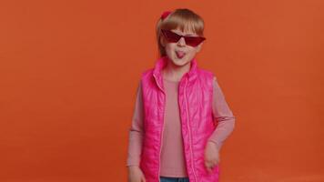 Funny joyful girl making playful silly facial expressions, grimacing, fooling around showing tongue video